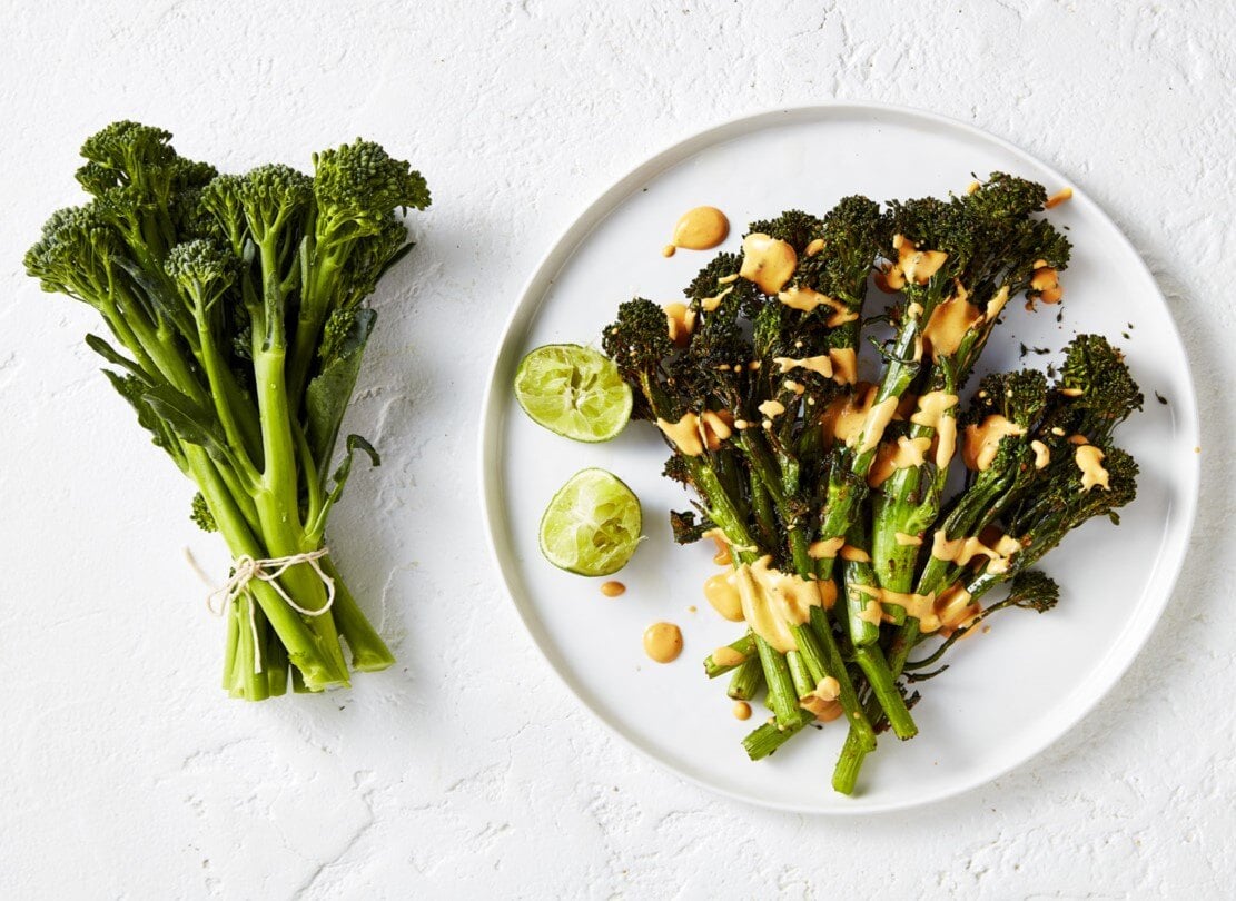 Crispy air fried broccolini drizzled with chipotle mayo